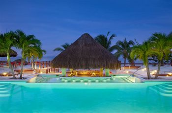 Couples Negril nighttime pool